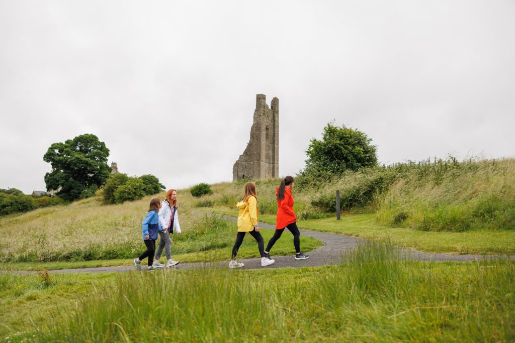 All-Inclusive Family Trips to Ireland - family walking up to Trim Castle