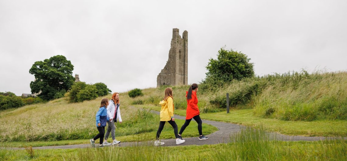 All-Inclusive Family Trips to Ireland - family walking up to Trim Castle